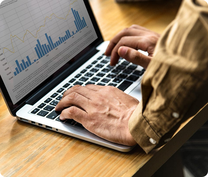 A man and woman sit side by side at a table with divorce papers. The man holds a pen, suggesting decision-making. The atmosphere is tense and serious.